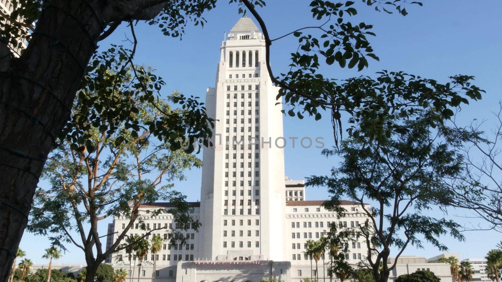 LOS ANGELES, CALIFORNIA, USA - 30 OCT 2019: City Hall highrise building exterior in Grand Park. Mayor's office in downtown. Municipal civic center, federal authority, headquarters of government in LA by DogoraSun