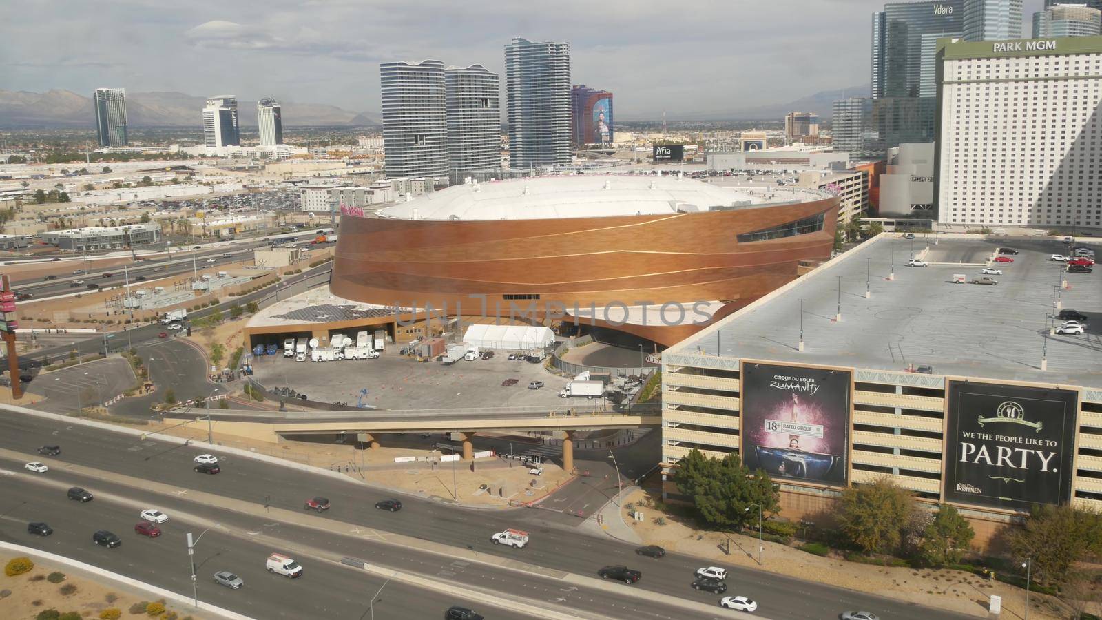 LAS VEGAS, NEVADA USA - 7 MAR 2020: Sin city in Mojave desert from above. Traffic highway in valley with arid climate. Aerial view of road in tourist metropolis. Gambling and betting area with casino by DogoraSun