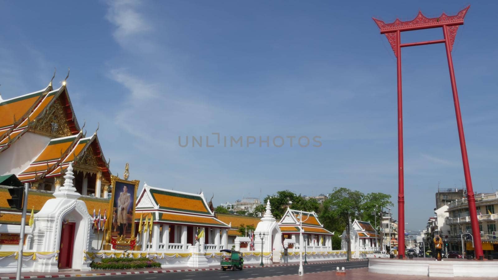 BANGKOK, THAILAND - 11 JULY, 2019: Giant Swing religios historic monument near traditional wat Suthat buddist temple. Iconic city view, cultural symbol. Famous landmark and classic tourist attraction. by DogoraSun