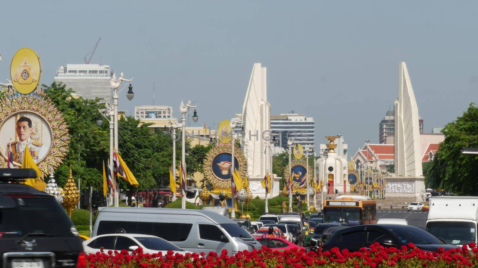 BANGKOK, THAILAND - 11 JULY, 2019: Rush hour traffic near Democracy Monument in capital. Famous asian landmark and travel destination. Democratic and patriotic symbol and public transport in downtown by DogoraSun