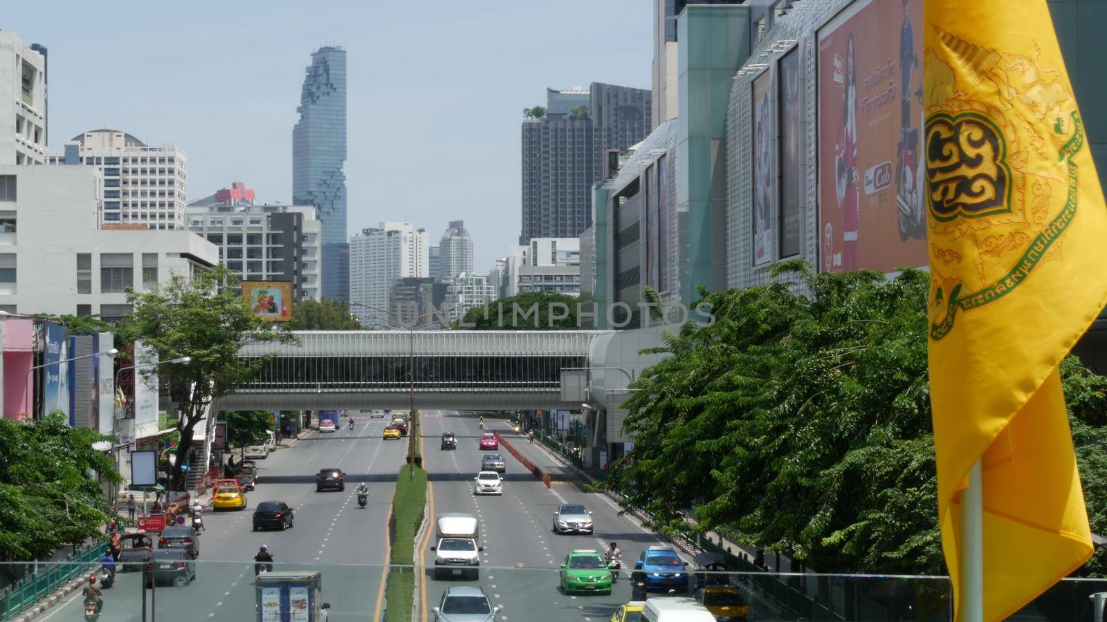 BANGKOK, THAILAND - 13 JULY, 2019: Mahanakhon King Power skyscraper in modern Sathorn financial business district. Maha Nakhon - tallest futuristic building. Rush hour traffic, cars and bts skytrain.