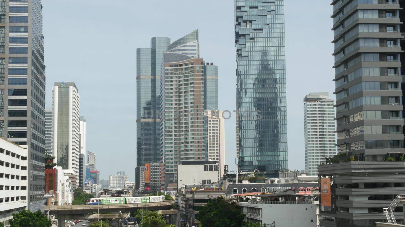 BANGKOK, THAILAND - 13 JULY, 2019: Mahanakhon King Power skyscraper in modern Sathorn financial business district. Maha Nakhon - tallest futuristic building. Rush hour traffic, cars and bts skytrain.