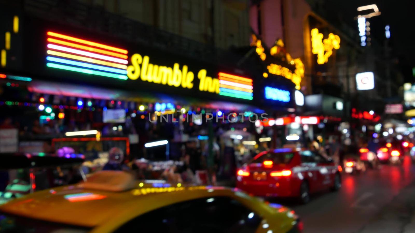 BANGKOK, THAILAND,13 JULY 2019 Vivid neon signs glowing, Nana Plaza street. Nightlife in erotic Red light district soi. Illuminated bar and adult go-go show club. Night life tourist entertainment