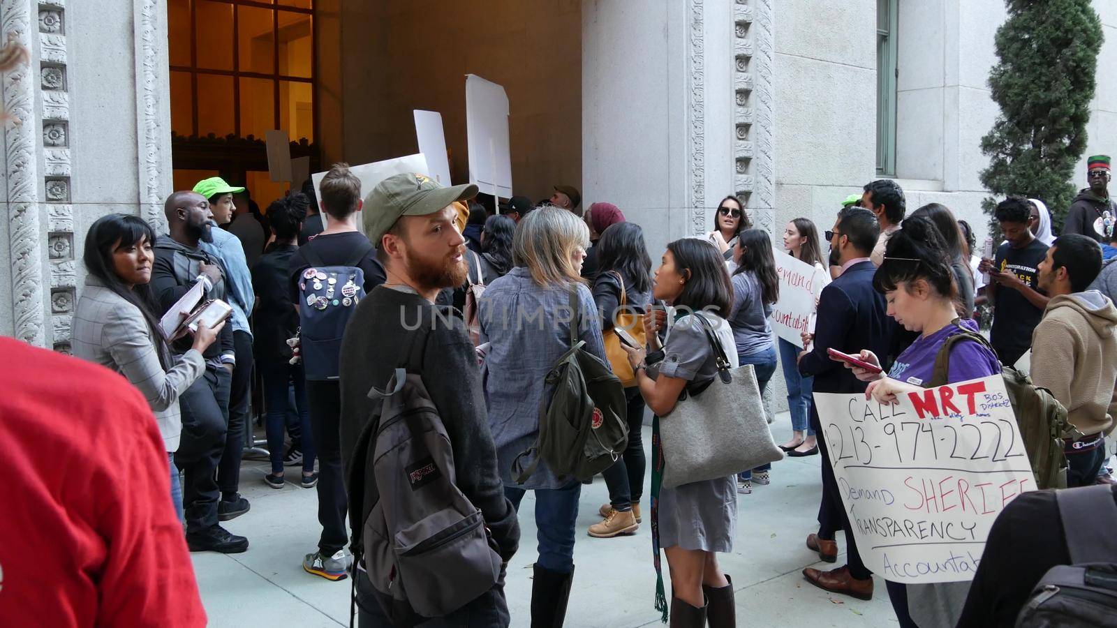 LOS ANGELES, CALIFORNIA, USA - 30 OCT 2019: People strike near Hall of Justice. Protest picket in front of Sheriff's Department and Courthouse. Demonstration of activists near LA government building.