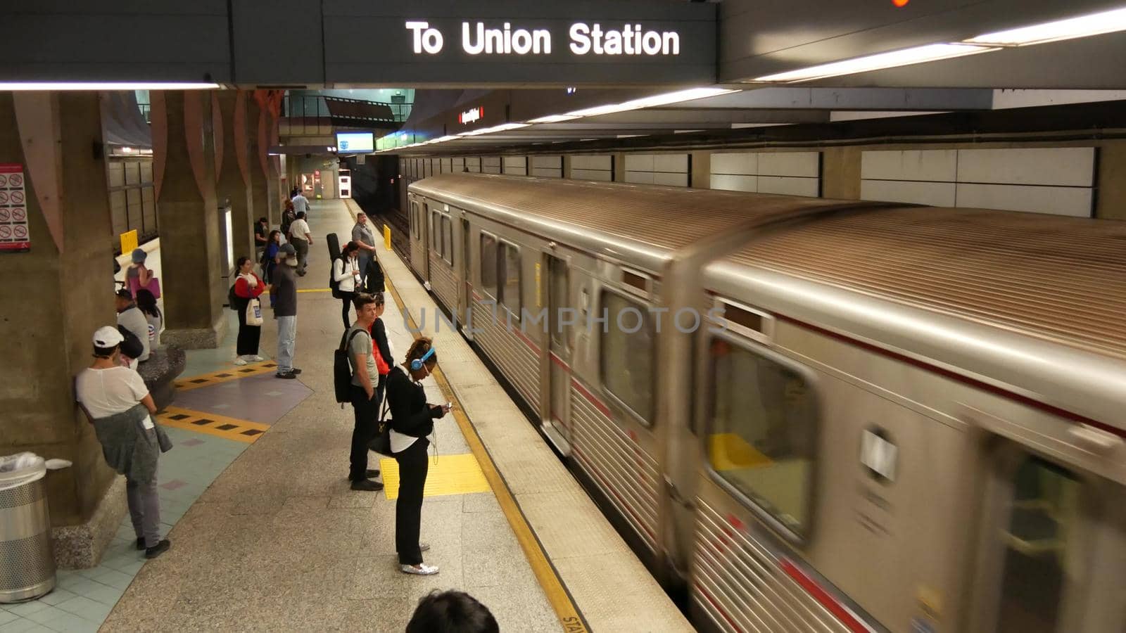 LOS ANGELES, CALIFORNIA, USA - 7 NOV 2019: Metro Rail transportation system. Metropolitan public passenger railway transport infrastructure. Citizens inside underground subway. People in LA City.