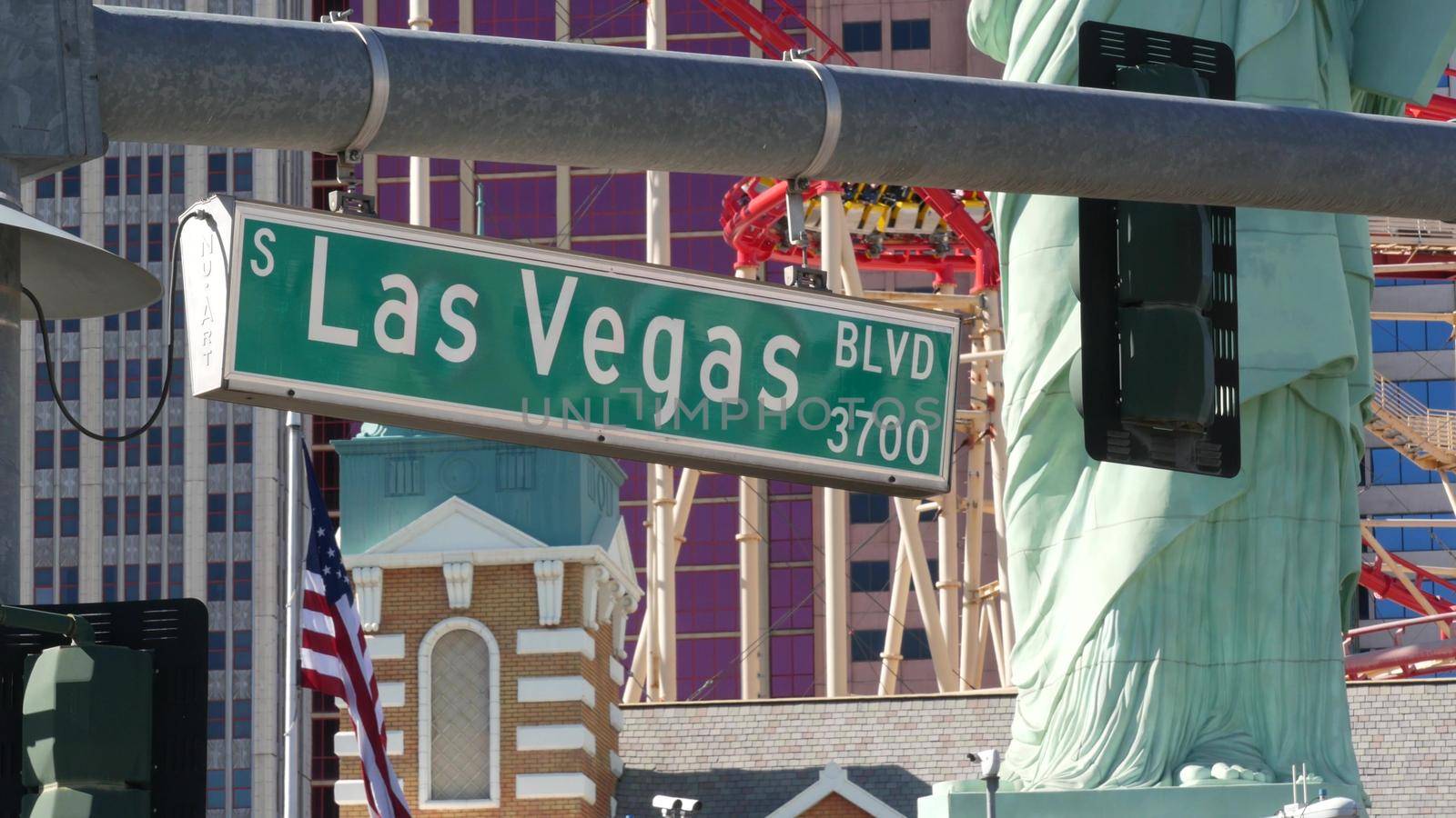 LAS VEGAS, NEVADA USA - 8 MAR 2020: Traffic sign on The Strip in fabulous sin city. Iconic signboard on road to Fremont street against New York hotel and casino. Symbol of money playing and betting.