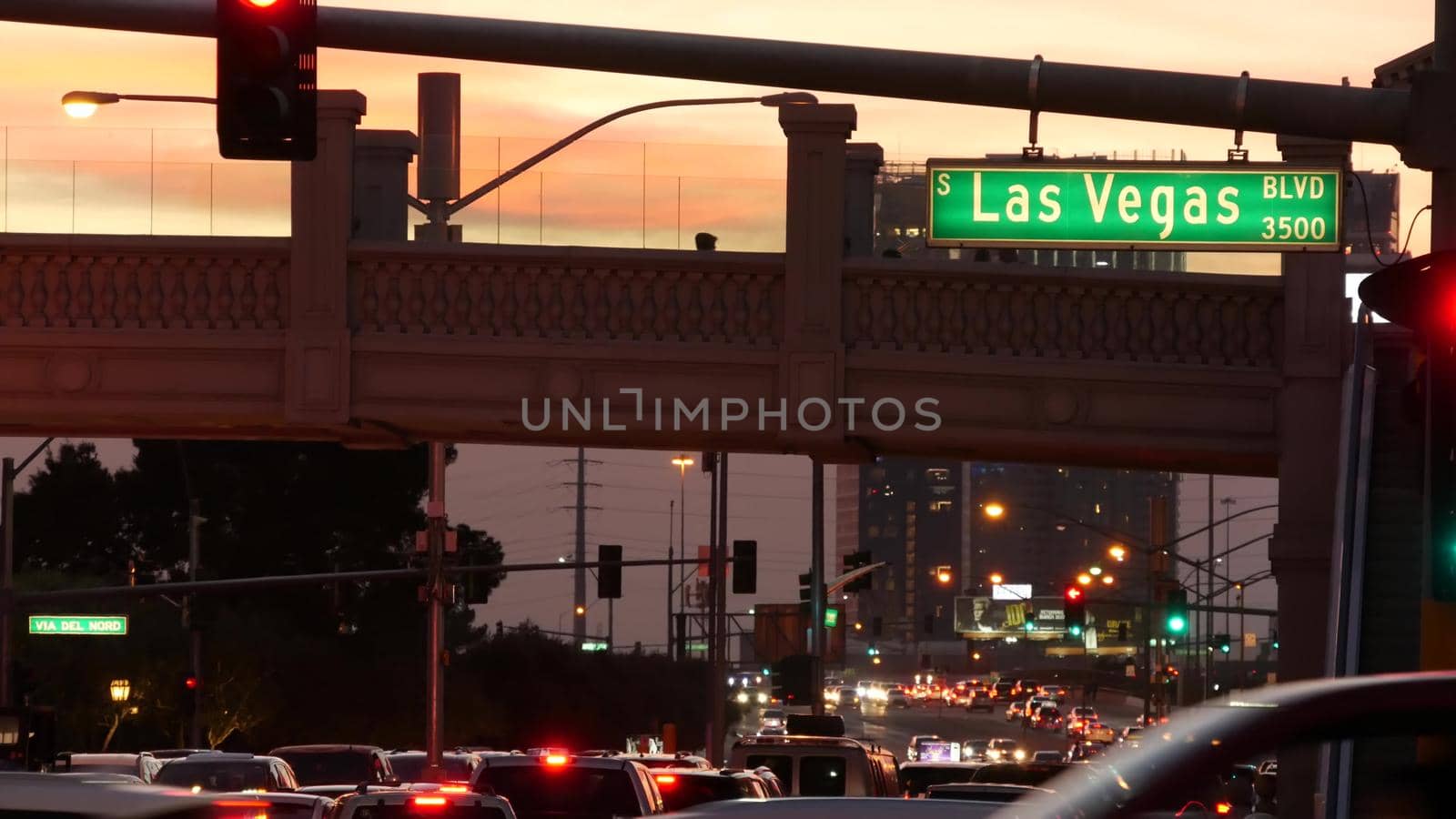 LAS VEGAS, NEVADA USA - 13 DEC 2019: Traffic sign glowing on The Strip in fabulous sin city. Iconic signboard on the road to Fremont street. Illuminated symbol of casino, money playing and betting by DogoraSun