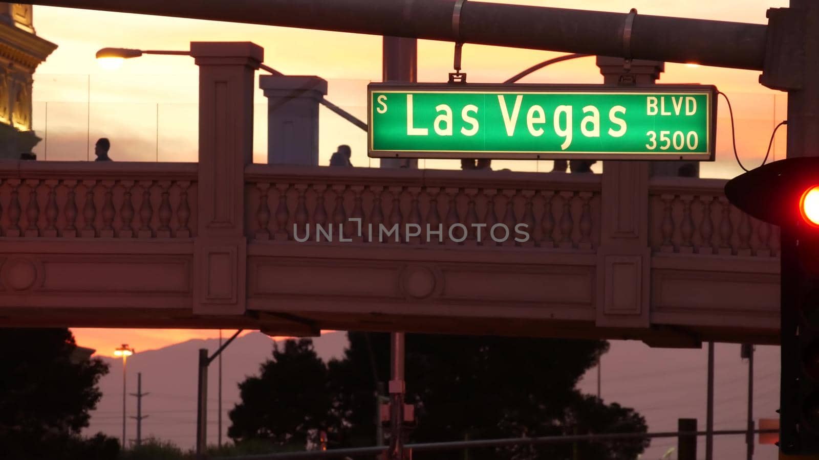 LAS VEGAS, NEVADA USA - 13 DEC 2019: Traffic sign glowing on The Strip in fabulous sin city. Iconic signboard on the road to Fremont street. Illuminated symbol of casino, money playing and betting.