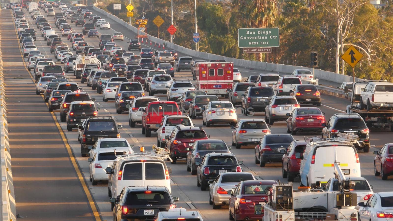 SAN DIEGO, CALIFORNIA USA - 15 JAN 2020: Emergency 911 auto on busy intercity freeway. Paramedic car in traffic jam on highway during rush hour. Transportation concept and transport in metropolis.