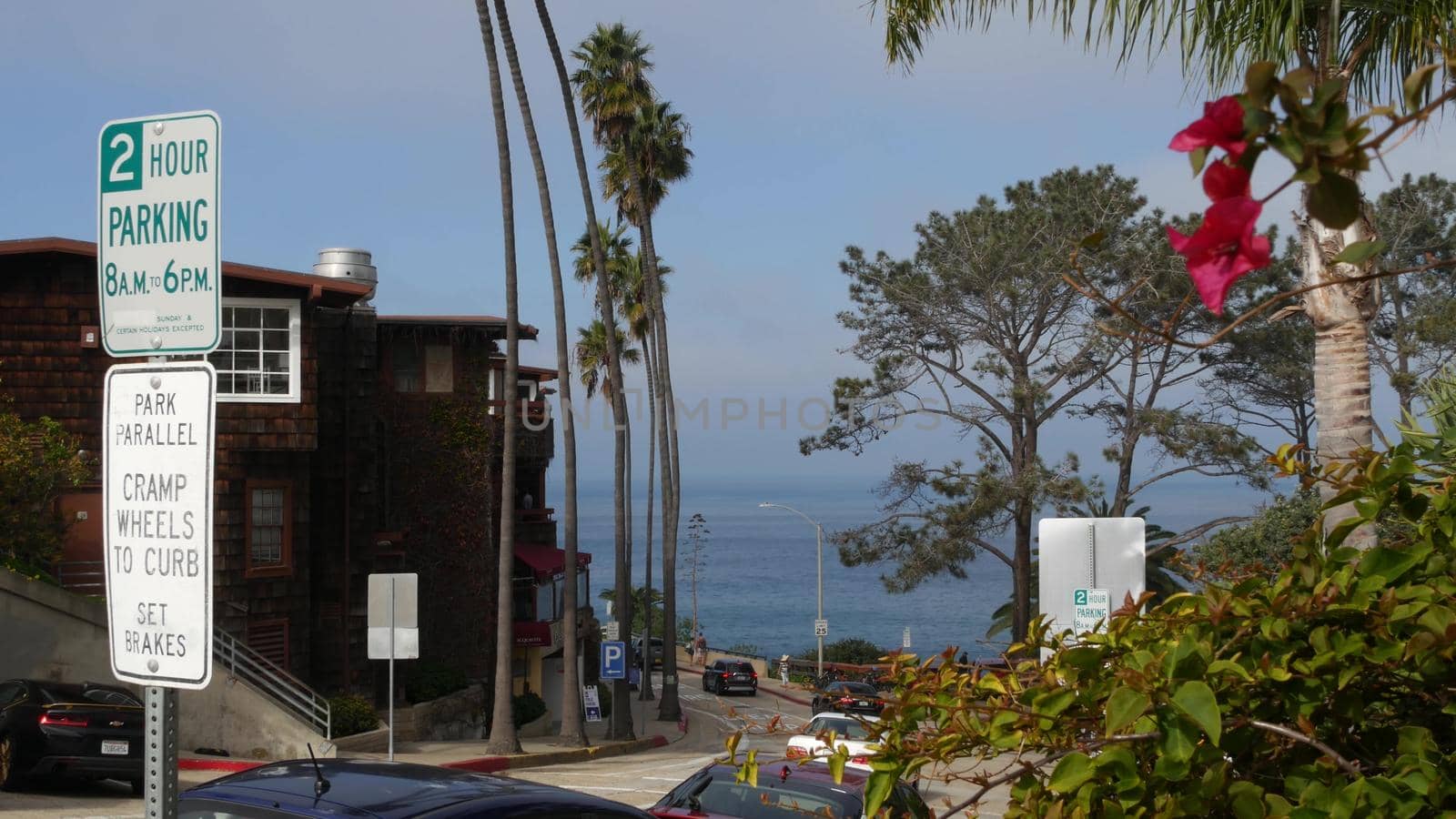 La Jolla, San Diego, CA USA -24 JAN 2020: Cars and buildings, downtown city street of californian coastal tourist resort. Cityscape with traffic, american travel destination for holidays and weekend.