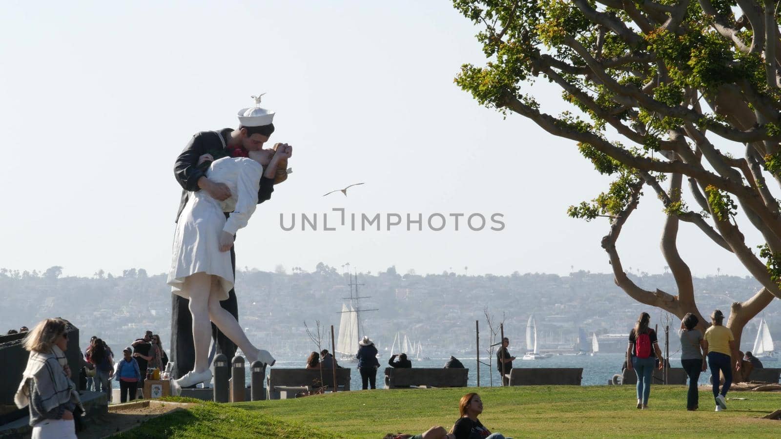 SAN DIEGO, CALIFORNIA USA - 23 FEB 2020: Unconditional Surrender Statue, USS Midway Museum. Symbol of navy fleet and Victory over Japan Day. Sailor kissing a woman, World War II memorial sculpture.