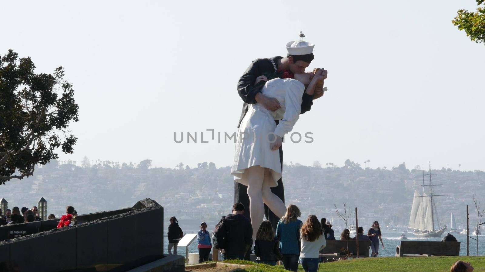 SAN DIEGO, CALIFORNIA USA - 23 FEB 2020: Unconditional Surrender Statue, USS Midway Museum. Symbol of navy fleet and Victory over Japan Day. Sailor kissing a woman, World War II memorial sculpture by DogoraSun