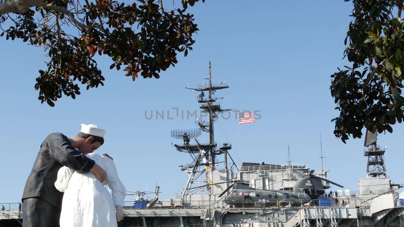 SAN DIEGO, CALIFORNIA USA - 23 FEB 2020: Unconditional Surrender Statue, USS Midway Museum. Symbol of navy fleet and Victory over Japan Day. Sailor kissing a woman, World War II memorial sculpture.
