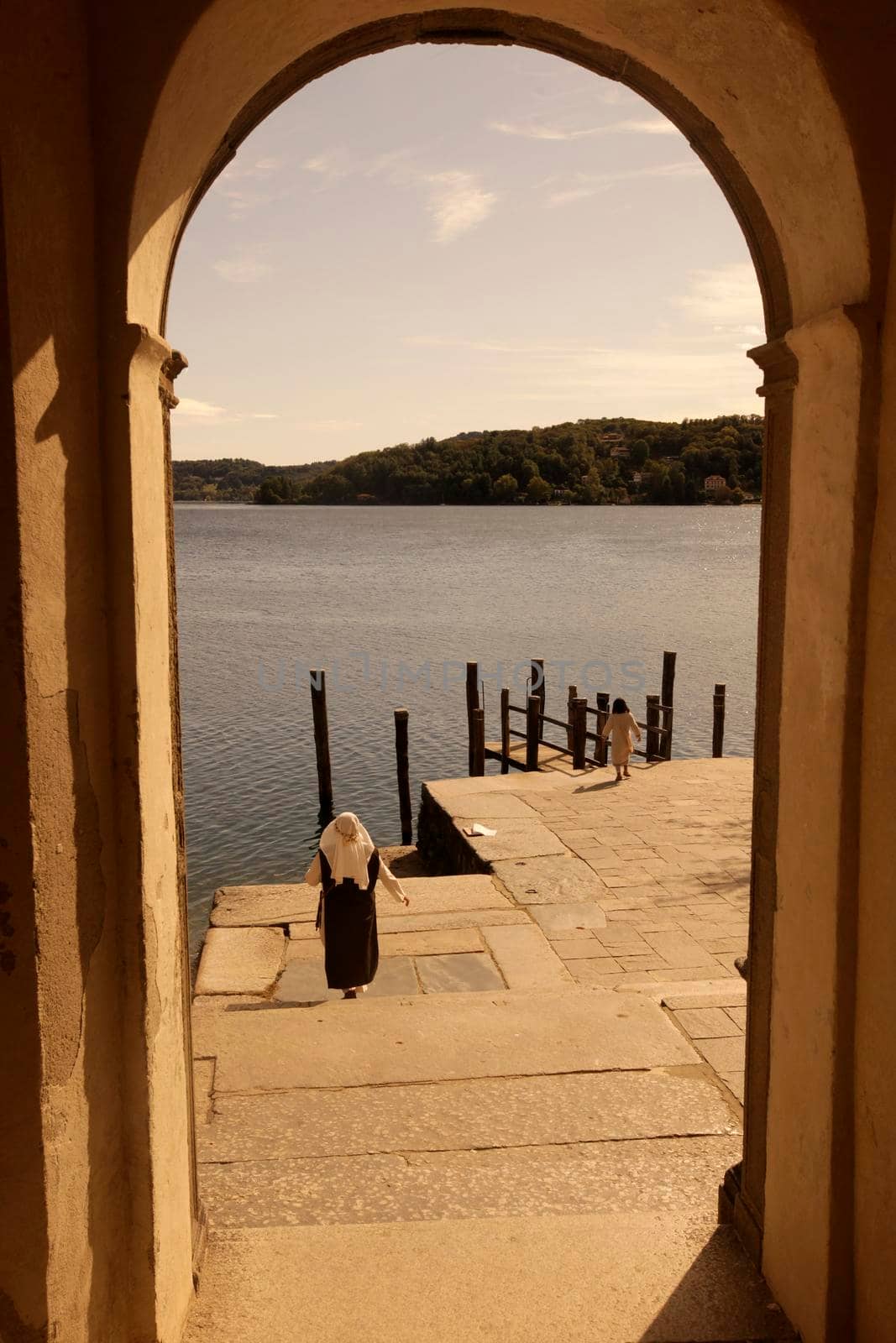 The Isla San Giulio in the Orta Lake near the Fishingvillage of Orta on the Lake Orta in Piemont in north Italy.  Italy, Piemont, October, 2011
