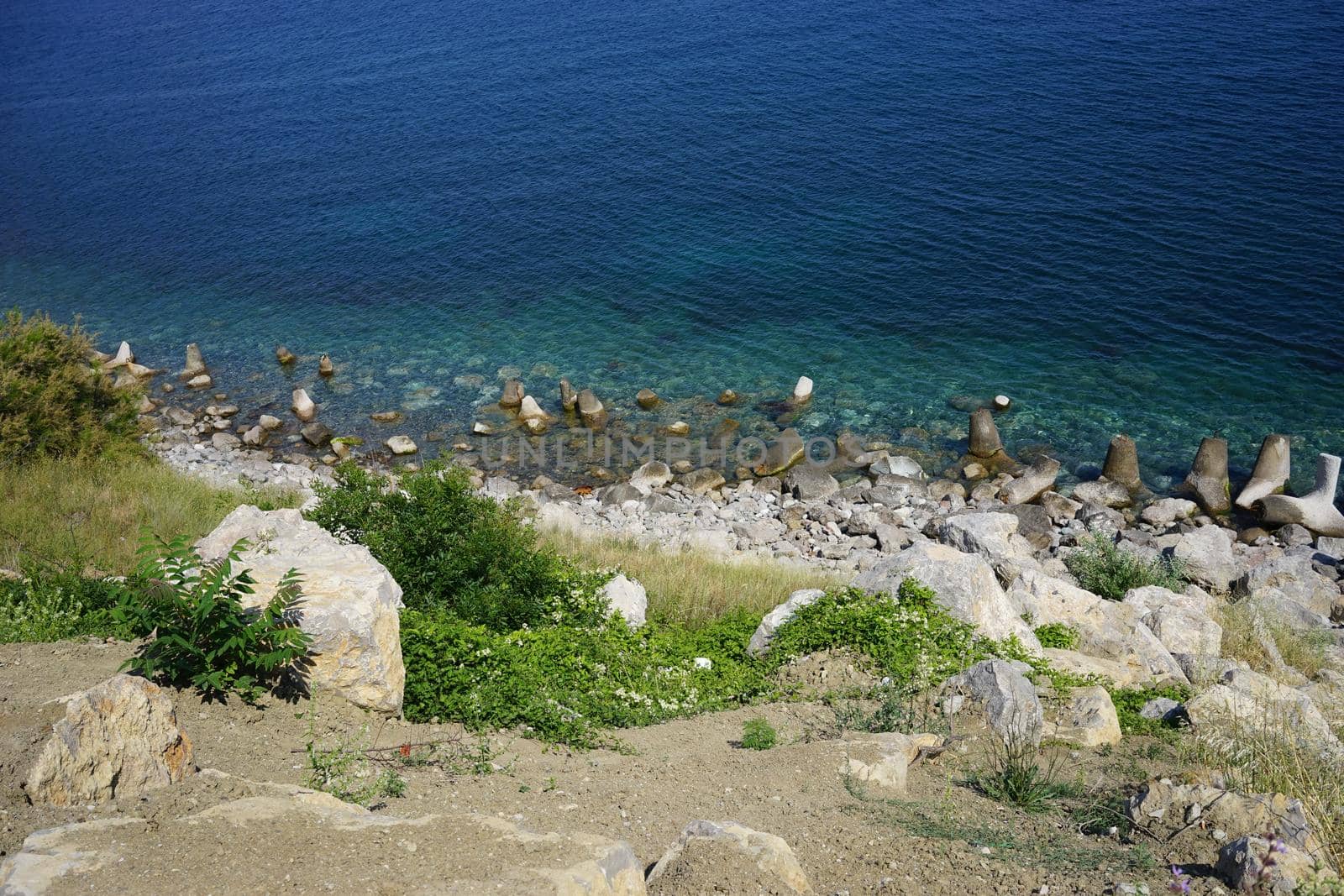 the rocky coastline, clear sea blue.