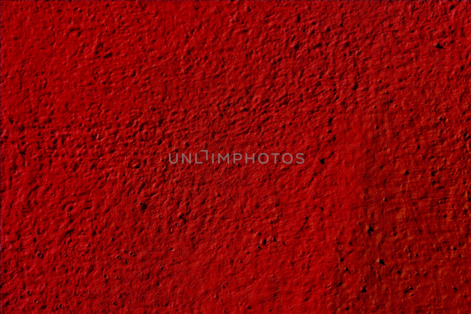 Textured red background of the wall plaster