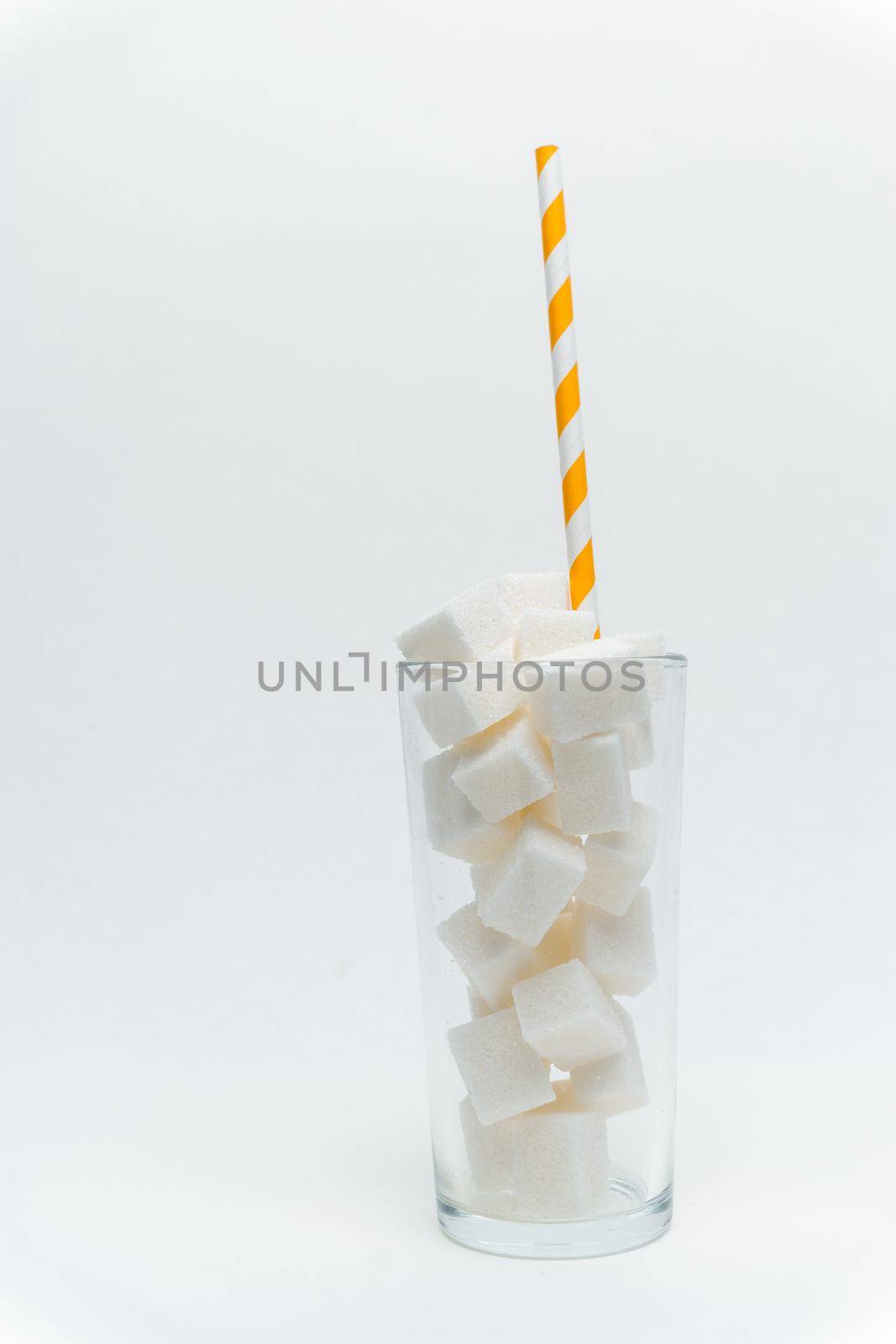 sugar cubes in a glass with a tube high-calorie cocktail. High quality photo