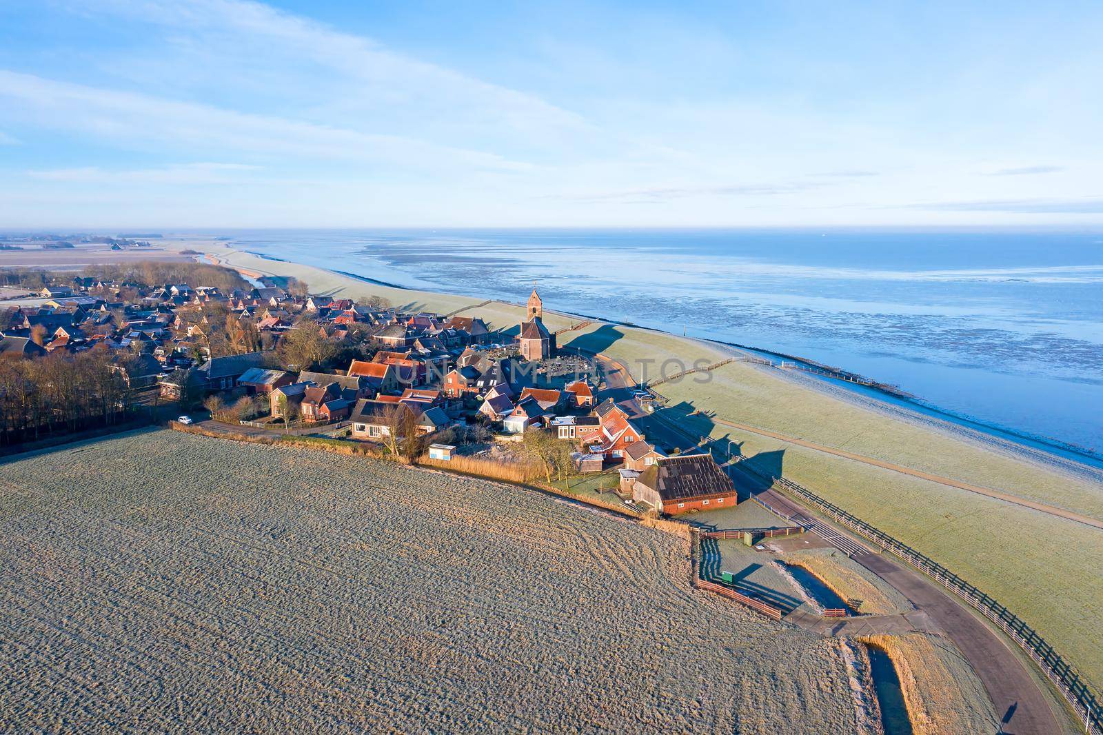 Aerial from the village Wierum on a beautiful winter day in the Netherlands by devy