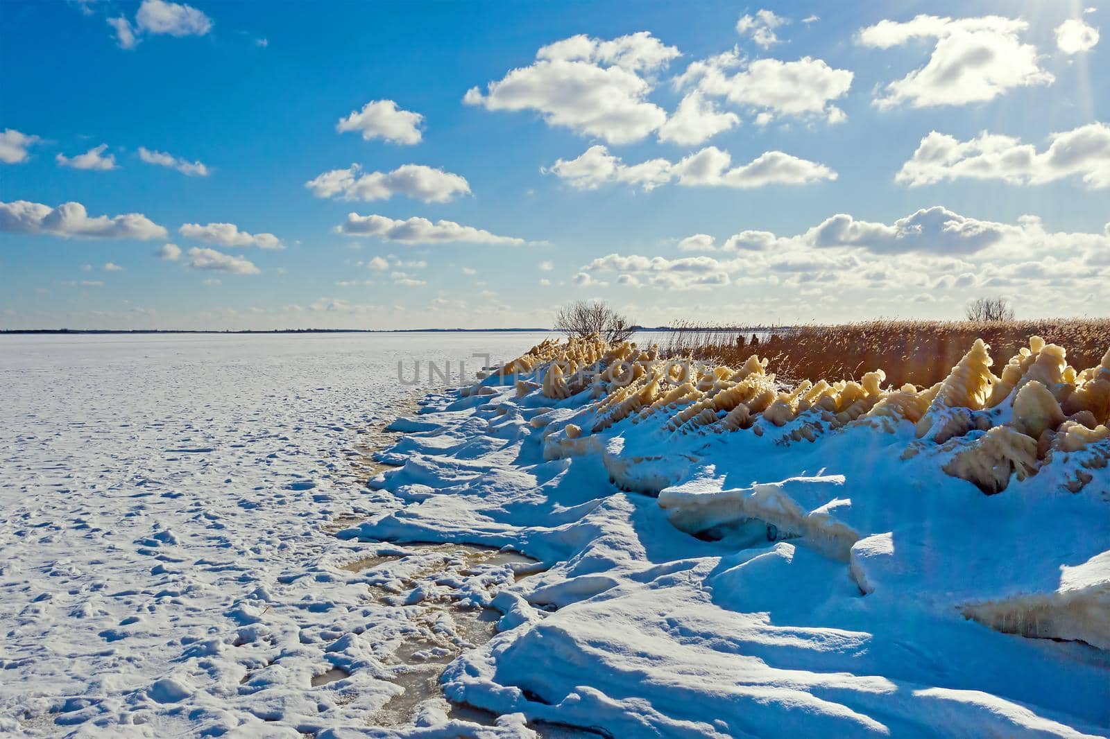 Aerial from a frozen Wadden Sea in the Netherlands in winter by devy