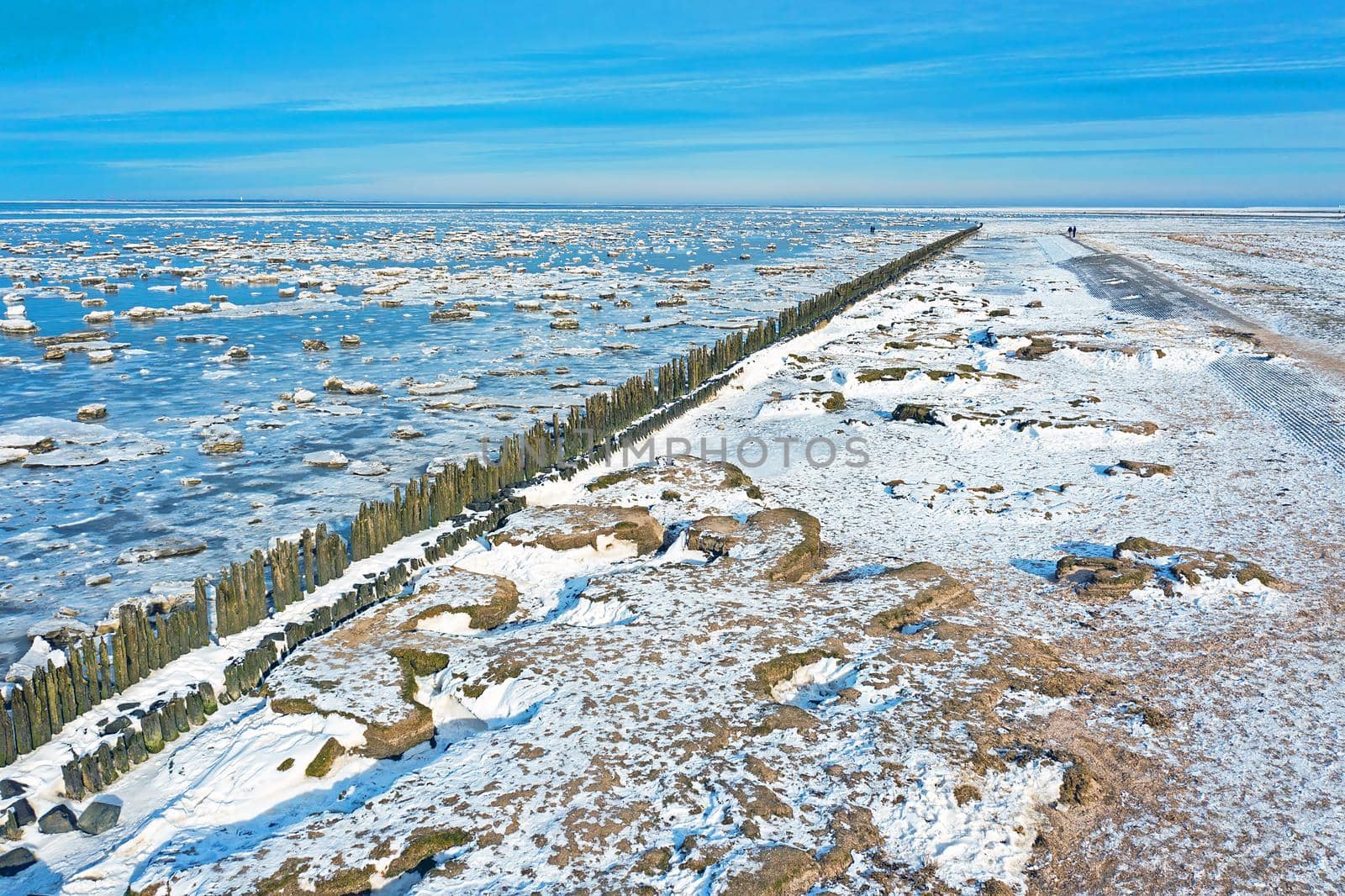 Aerial from a frozen Wadden Sea in the Netherlands in winter by devy