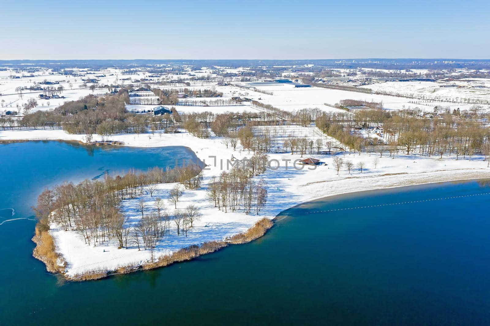 Aerial from lake Bussloo in the Netherlands in winter by devy