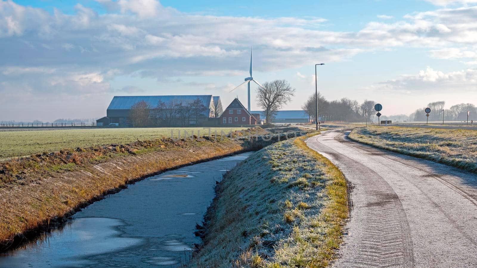 Winter landschape in the countryside from the Netherlands with windmills and farms