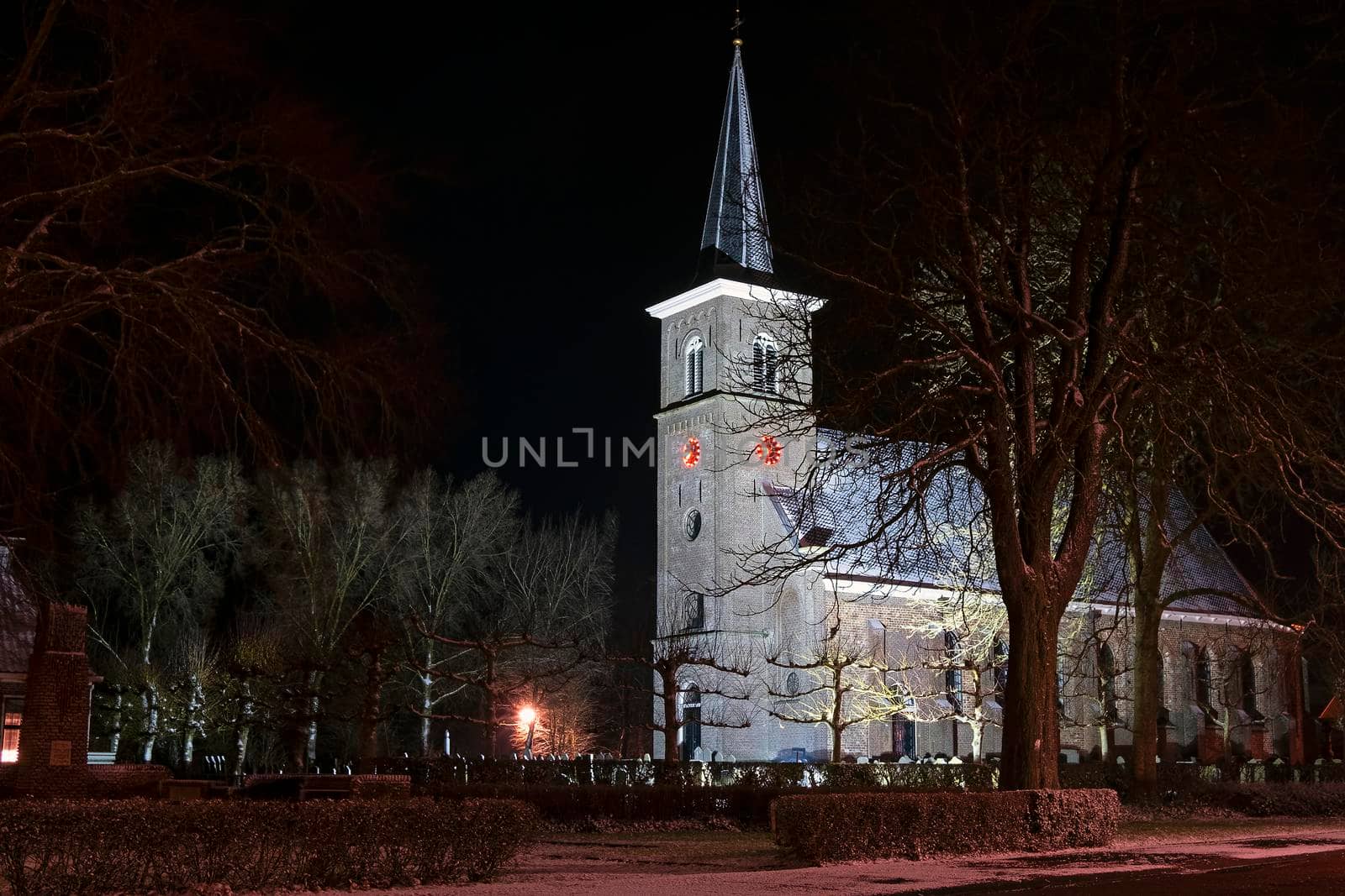 Snowy church from Ternaard in Friesland in the Netherlands at night
