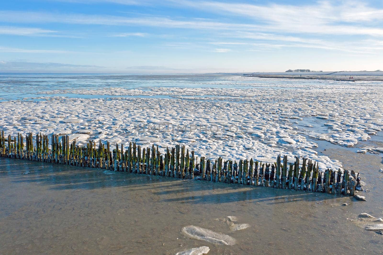 Aerial from a frozen Wadden Sea in the Netherlands in winter