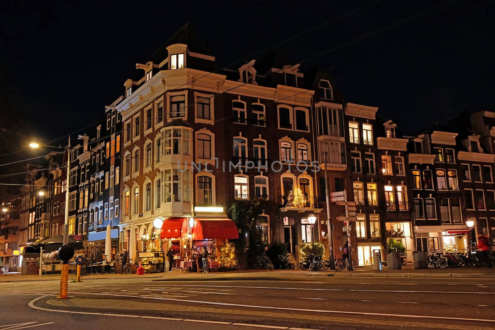 Traditional Amsterdam houses in christmas time in the Netherlands at night by devy