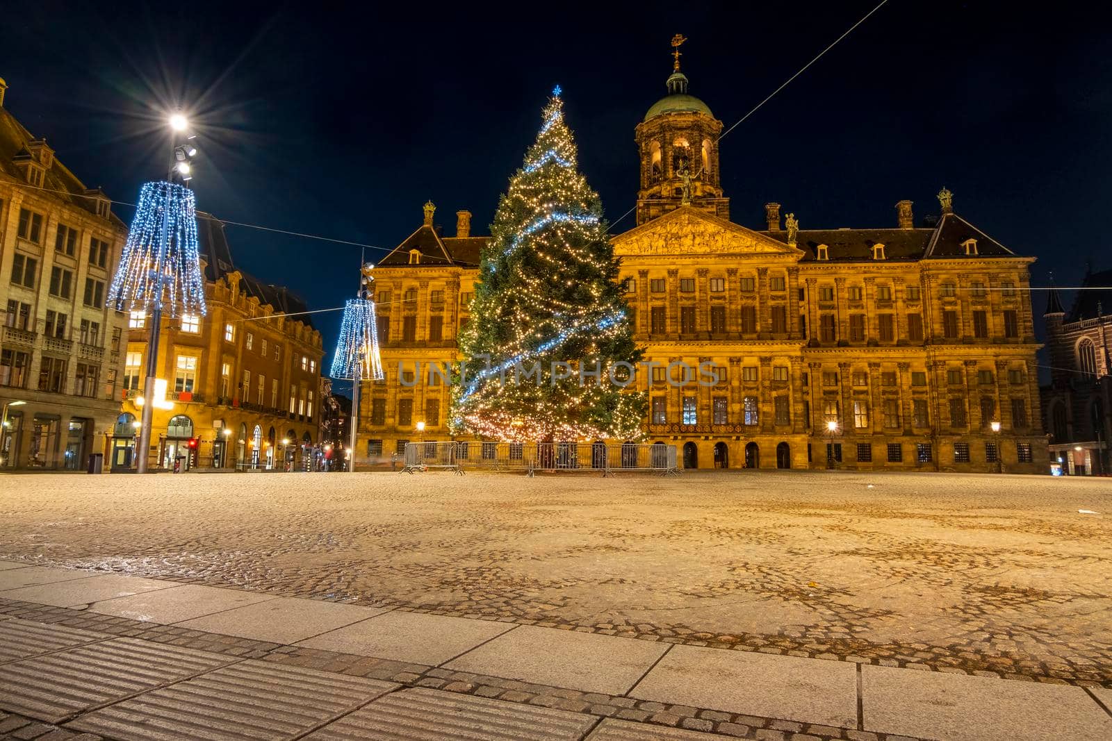 Christmas on the Dam square in Amsterdam at night in the Netherlands by devy