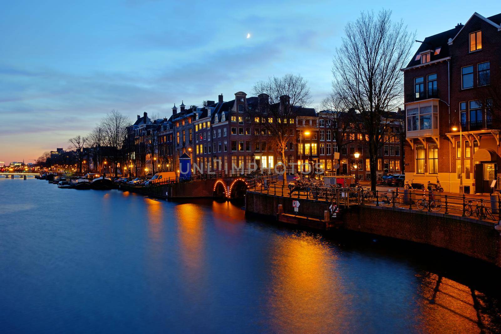 Amsterdam at the Amstel in the Netherlands at sunset