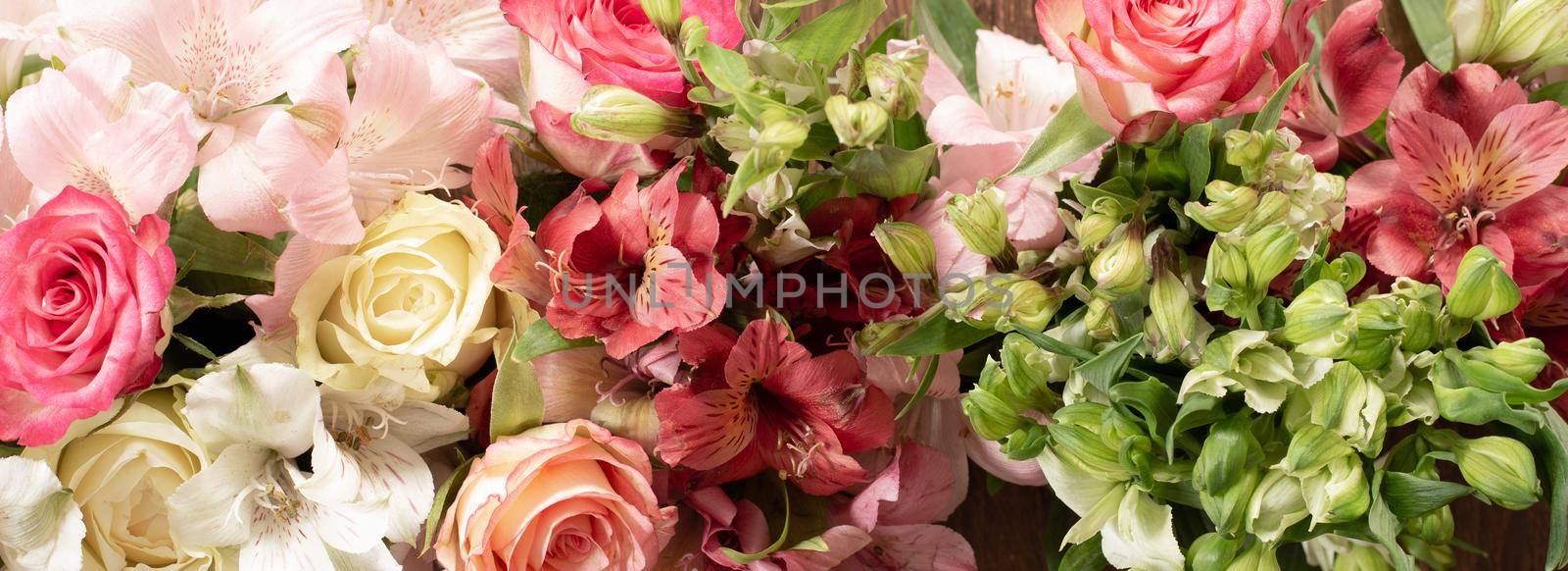 Flowers border composition. Alstroemeria Flowers, roses. Flat lay top view