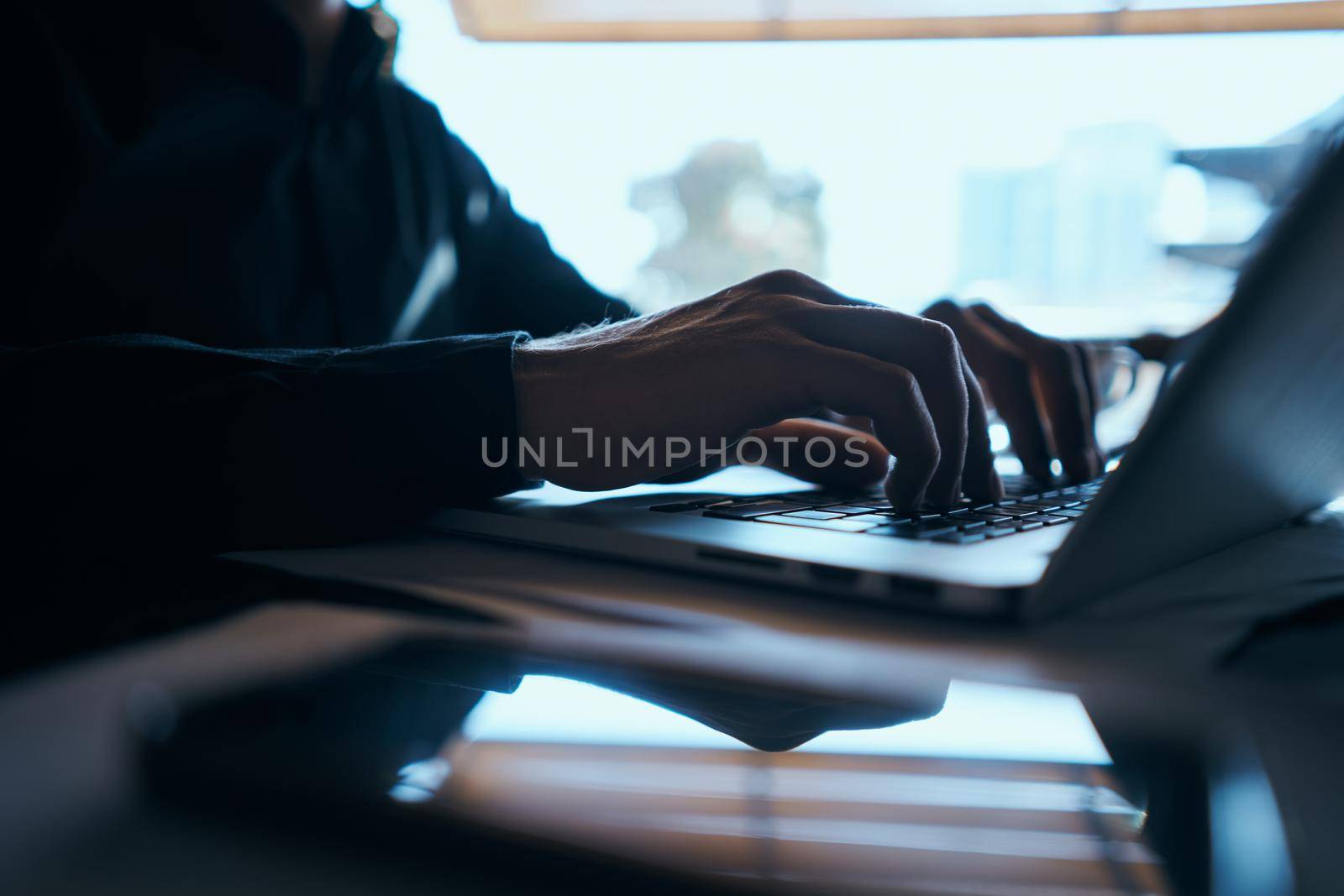 Man in a cafe and notebooks official work communication. High quality photo