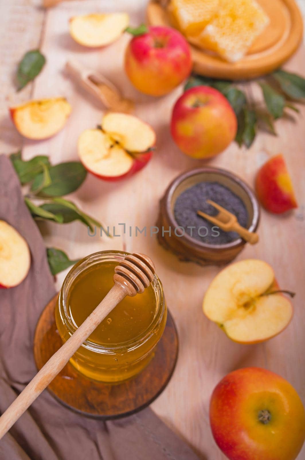 Jewish holiday Rosh Hashana background with apples, honey on blackboard. View from above. Flat lay