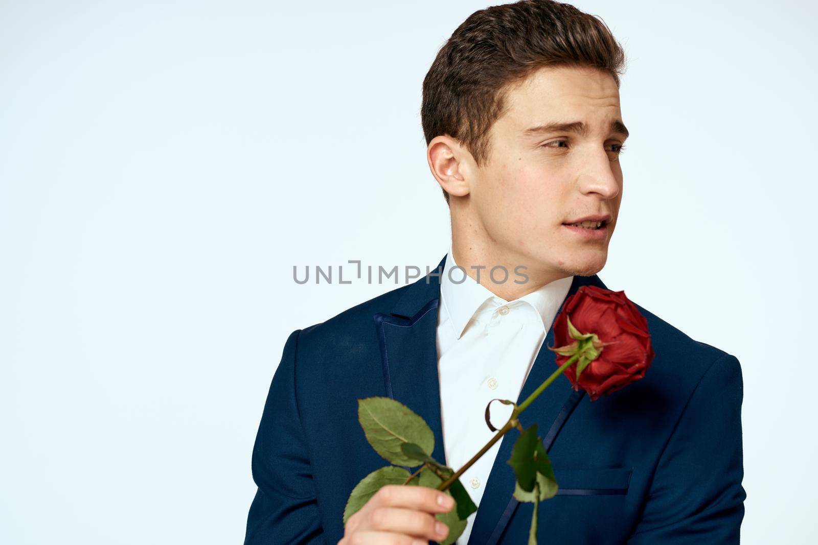 Business man in a flower suit romance date a gift. High quality photo