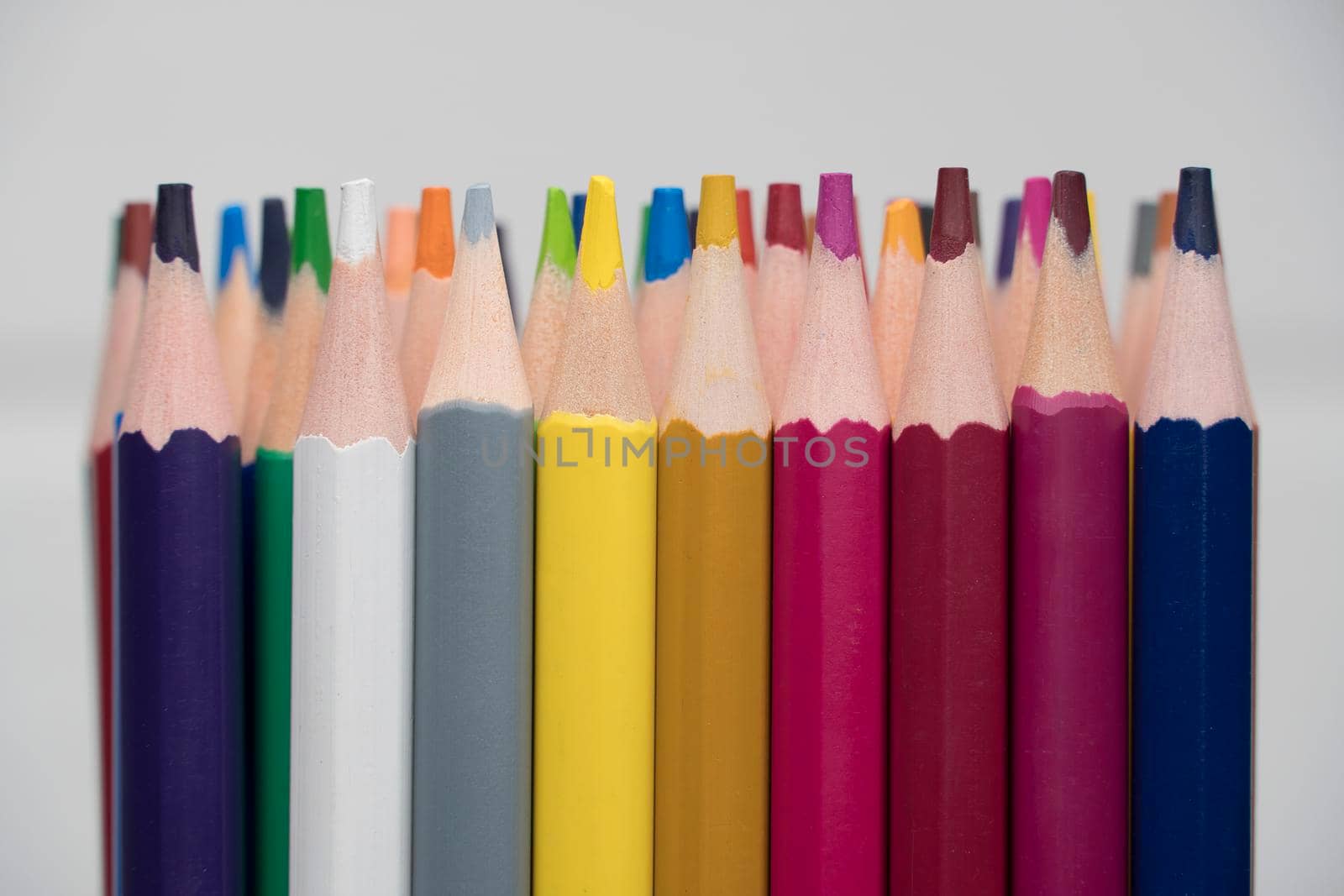 A set of colored pencils, stationery. Lots of colorful pencils on the table. Drawing and Visual Art Kits