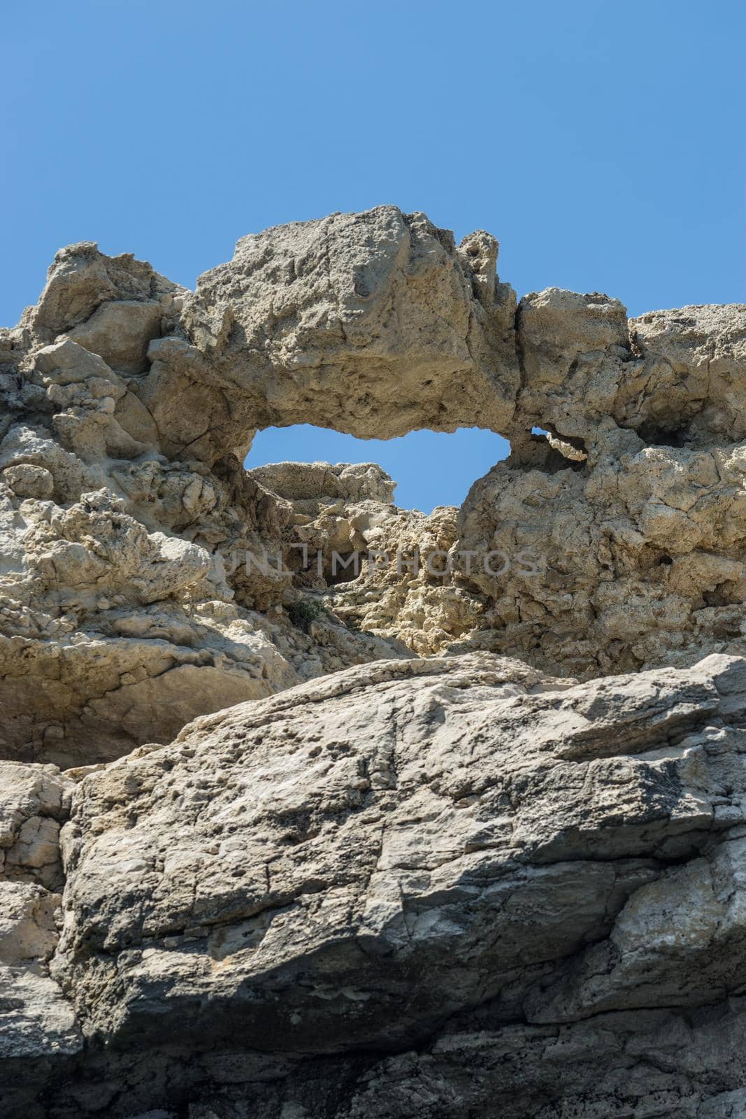 Crimean landmark: Cape Tarkhankut with beautiful rocks on the background of the sea and sky.