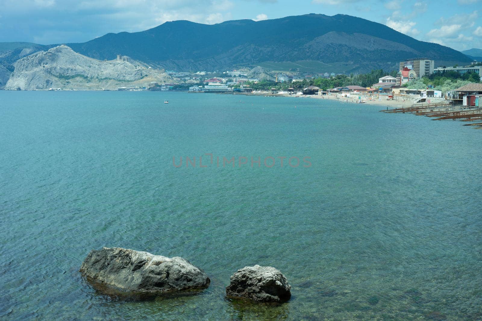 Seascape with rocks on the background of water. Sudak, Crimea
