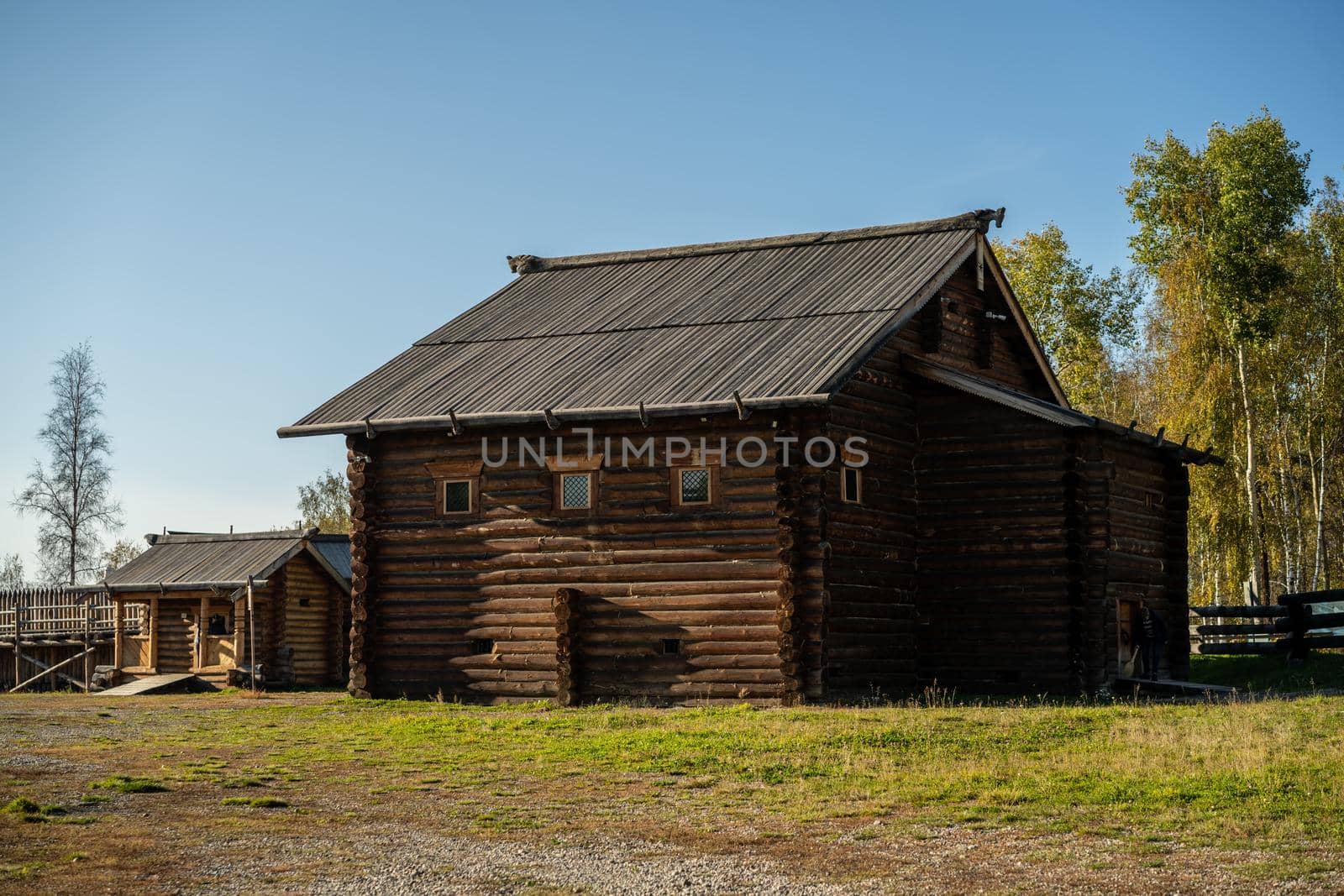 Natural landscape with wooden buildings. Irkutsk region, Taltsy