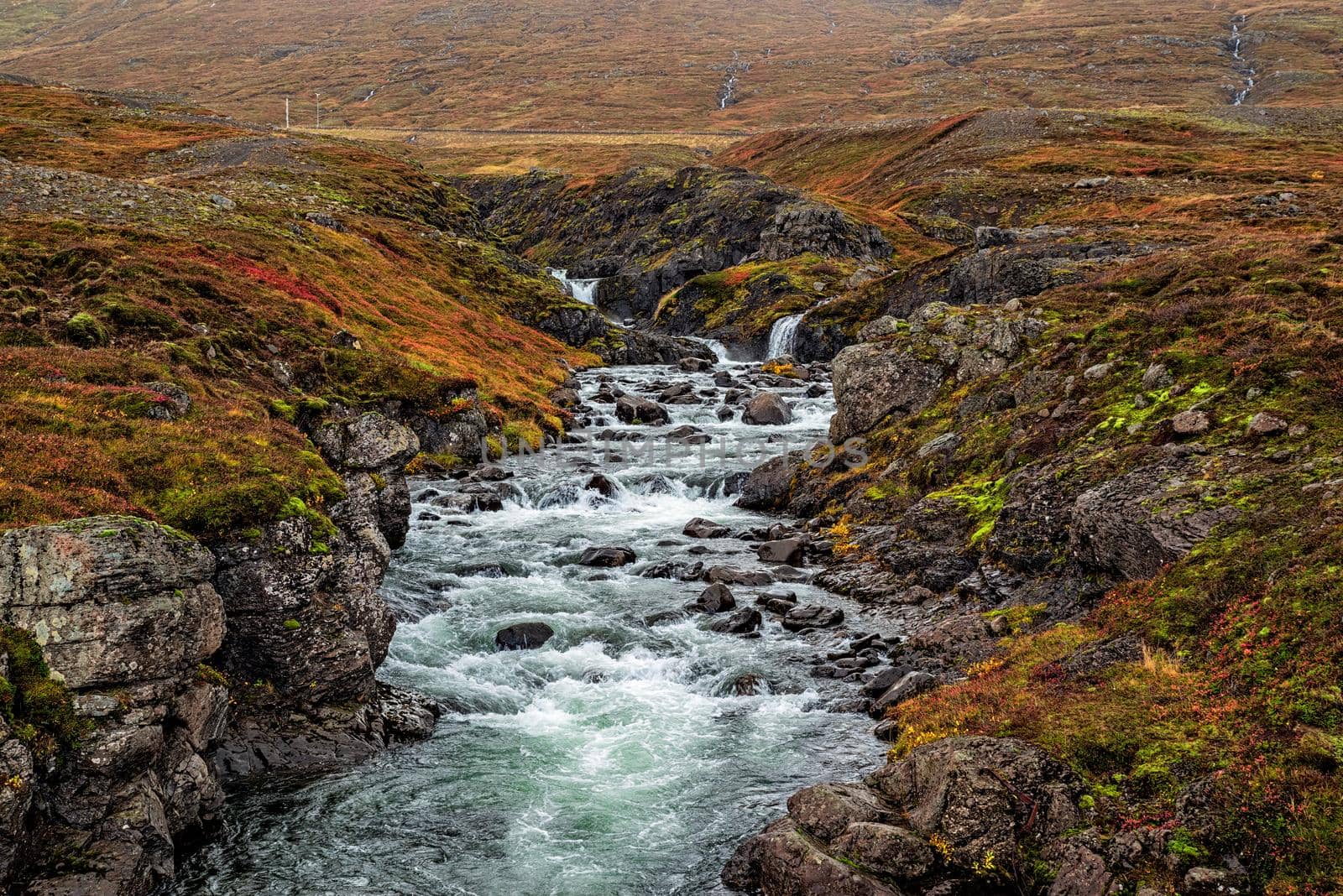 Small waterfalls on the road to Mjoifjordur, Iceland by LuigiMorbidelli