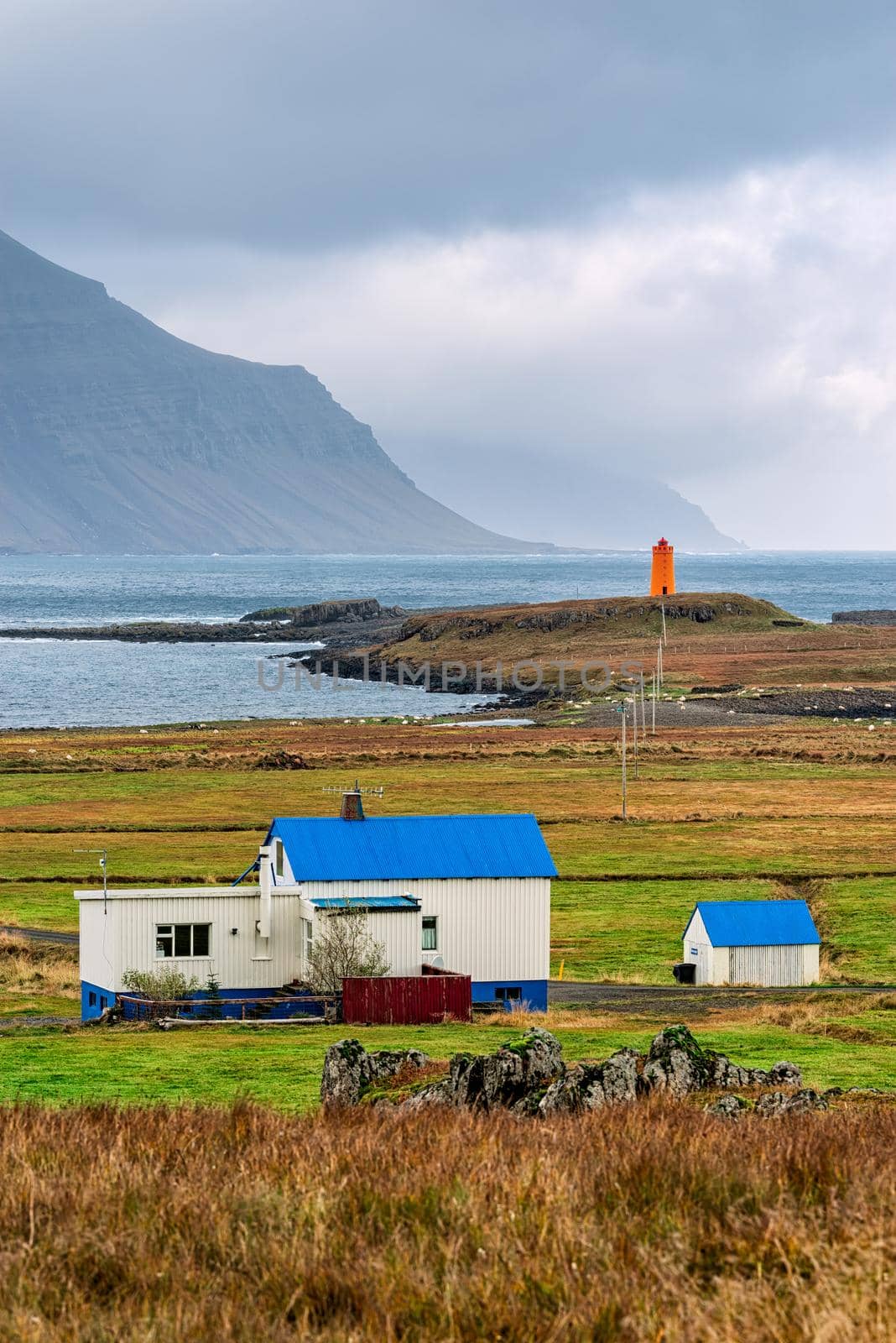 Reydarfjordur on the east side of Iceland and the lighthouse on a cloudy day