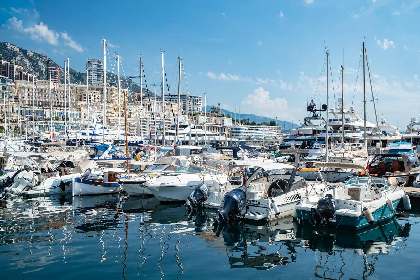 Monaco, Monte-Carlo, 06 August 2018: Tranquillity in port Hercules, is the parked boats, sunny day, many yachts and boats, RIVA, Casino Monte-Carlo, megayachts, massif of expensive real estate by vladimirdrozdin