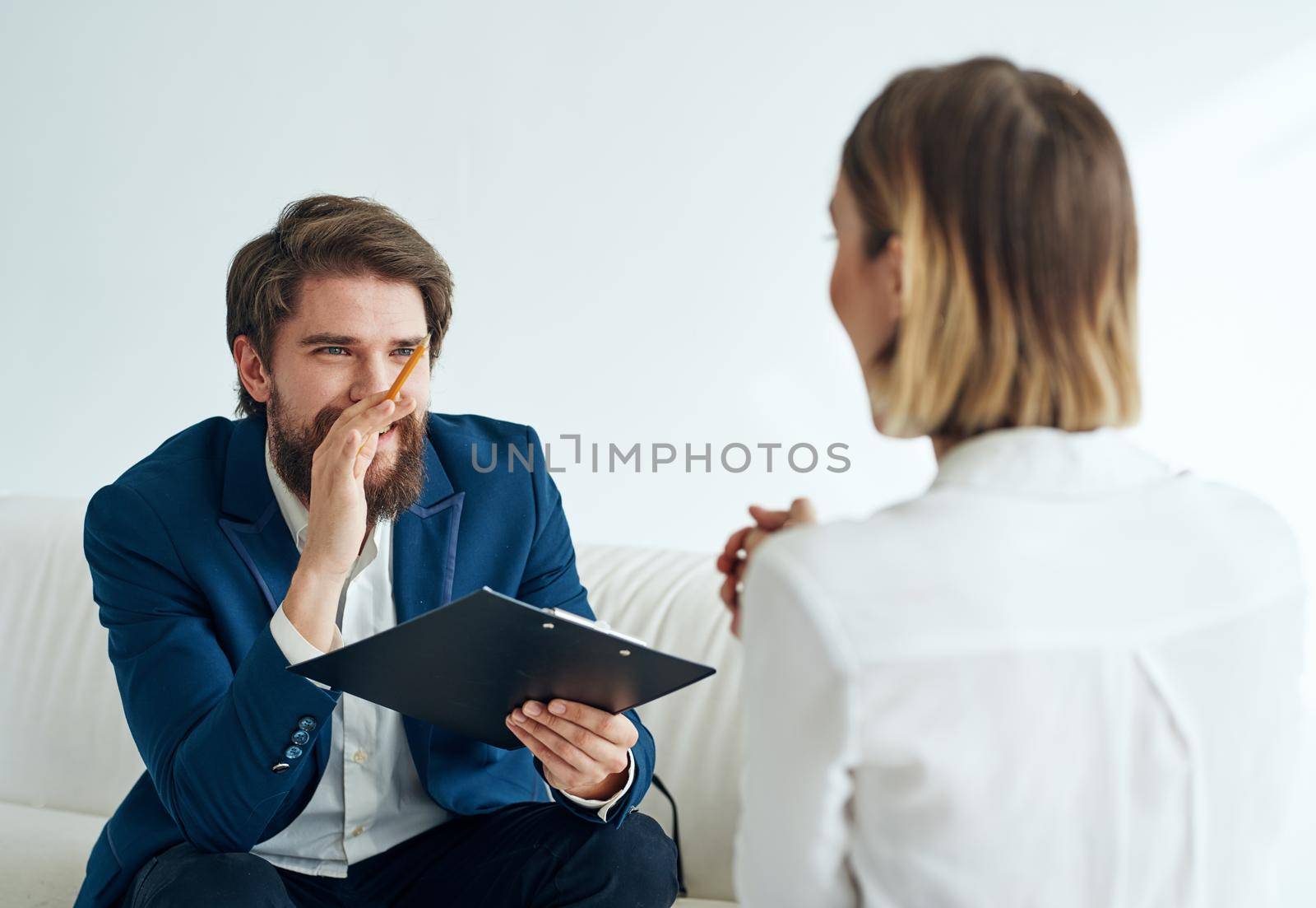 Man and woman sitting on the couch teamwork communication office. High quality photo