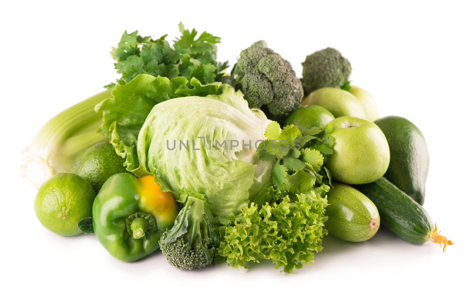 green fruits and vegetables on white background . by aprilphoto