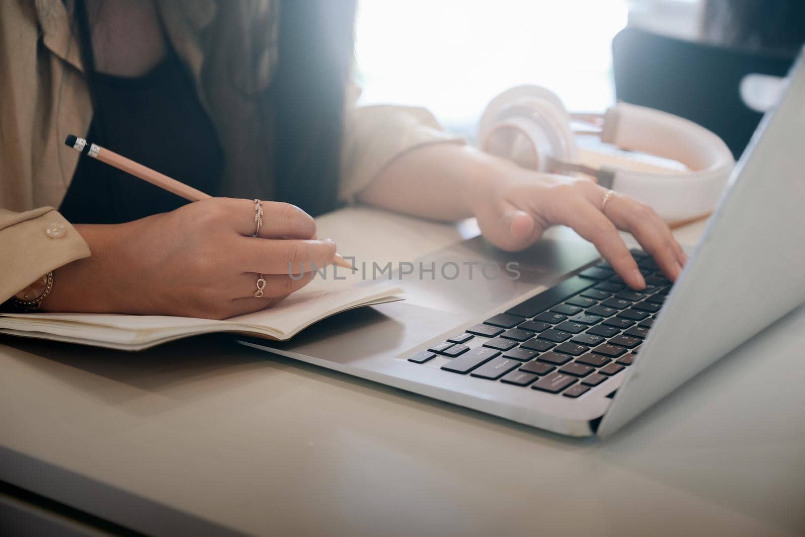 Closeup woman hands using computer laptop.