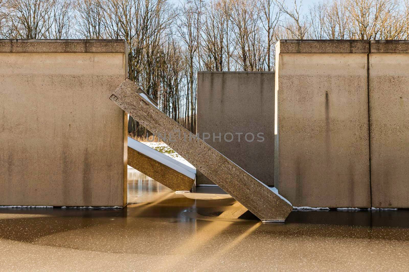 Concrete lab testing device in the middle of a artificial lake, was back in the days used for developing the Delta works in the sixties.