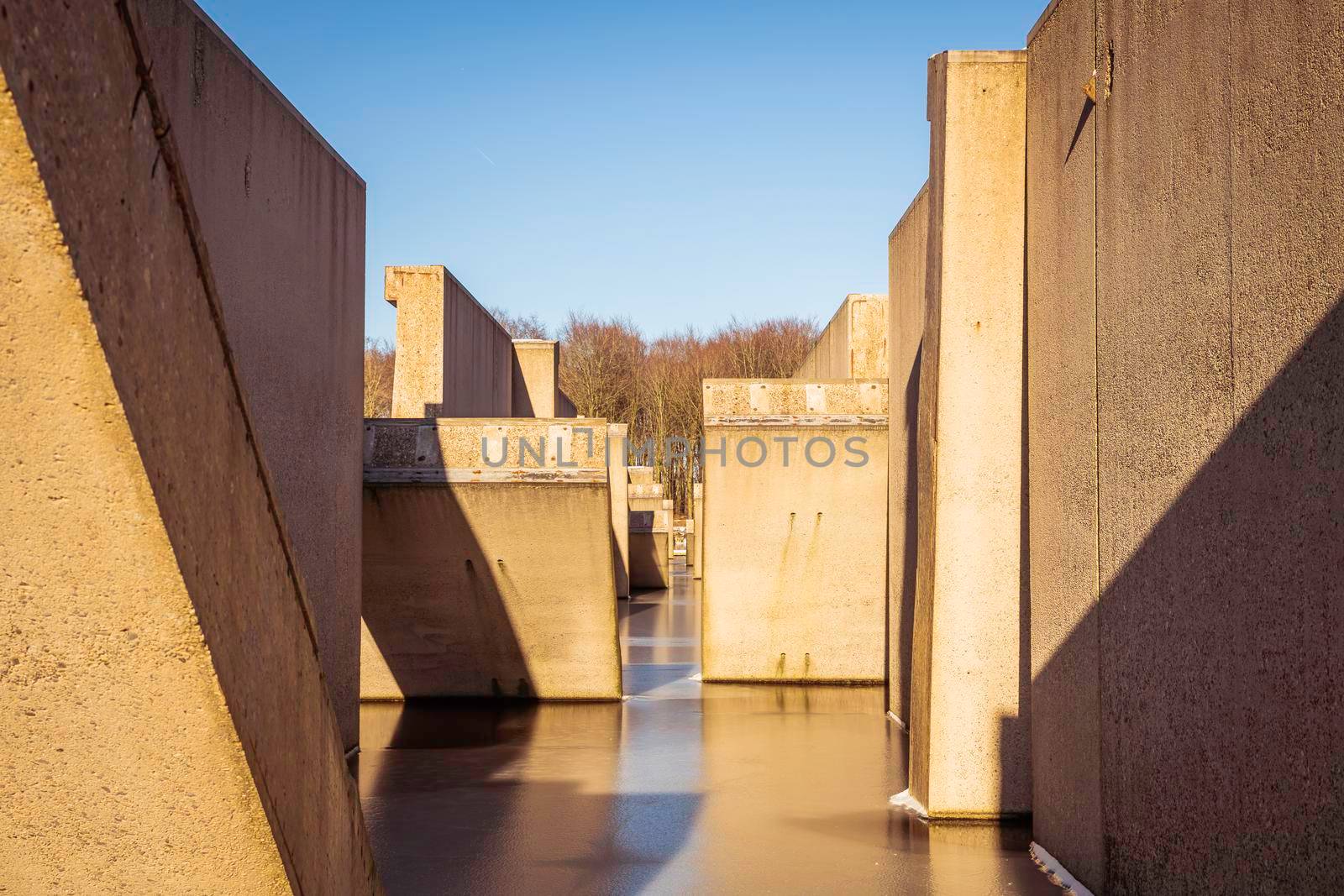 Concrete lab testing device in the middle of a artificial lake, was back in the days used for developing the Delta works in the sixties.