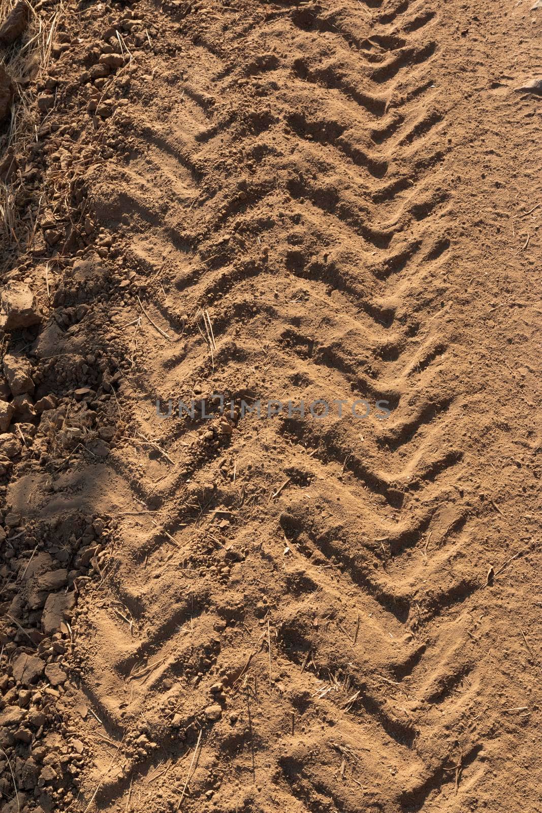 Tractor tracks on arid and dry terrain in southern Andalusia in Spain