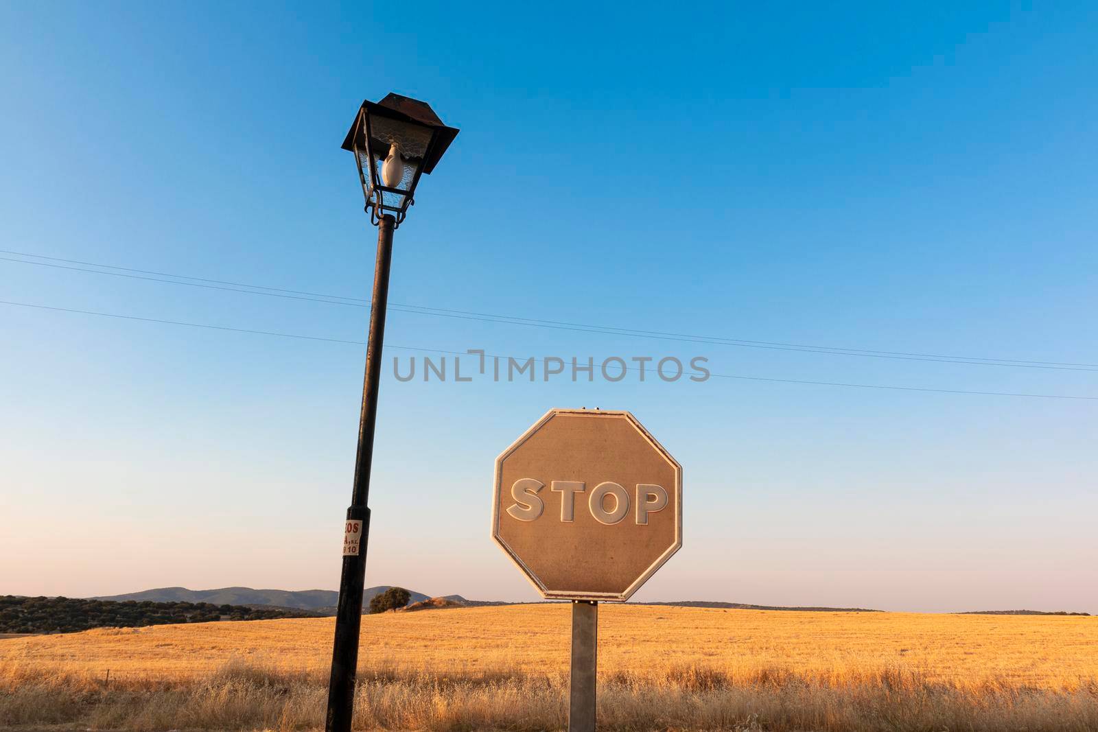 Sun-faded stop sign in southern spain