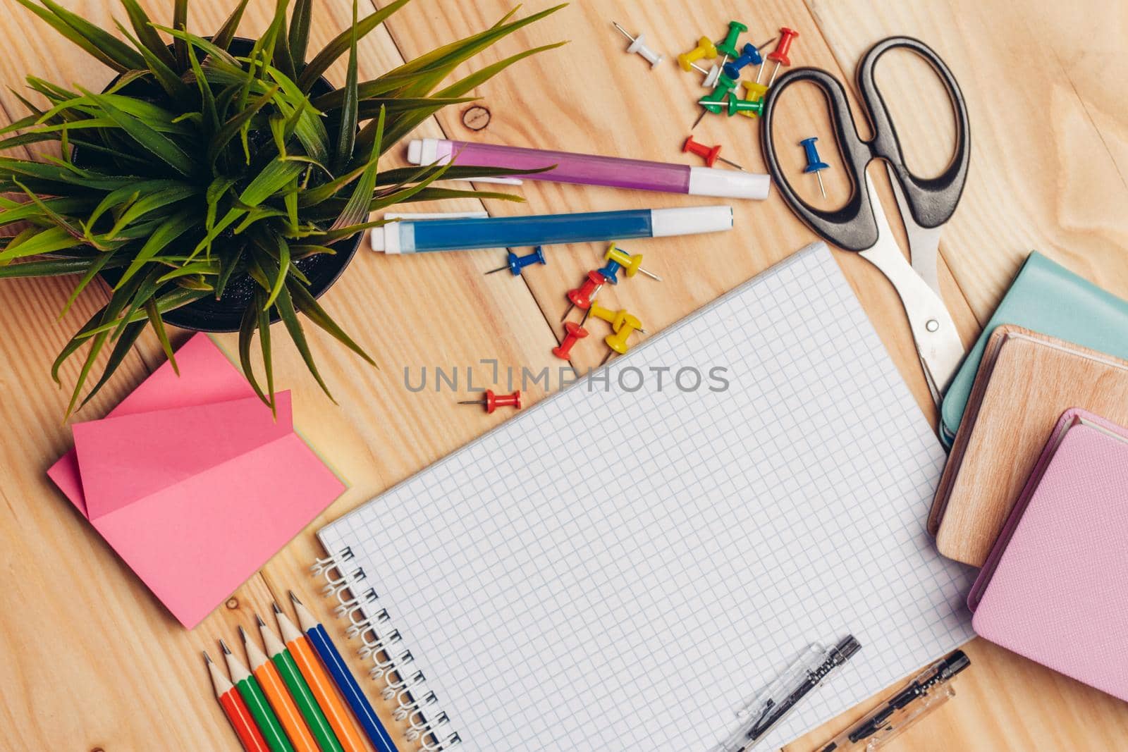 multicolored pencils and markers scissors paper creativity. High quality photo